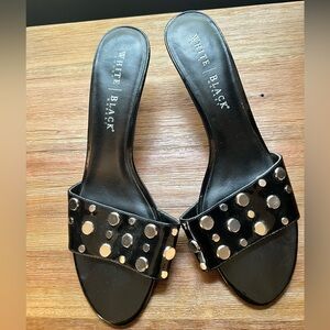 Black high heels with silver embellishments.